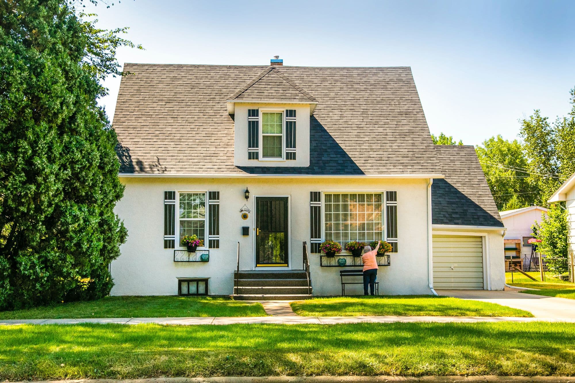 A well-kept single-family home on a tree-lined Front Range street.